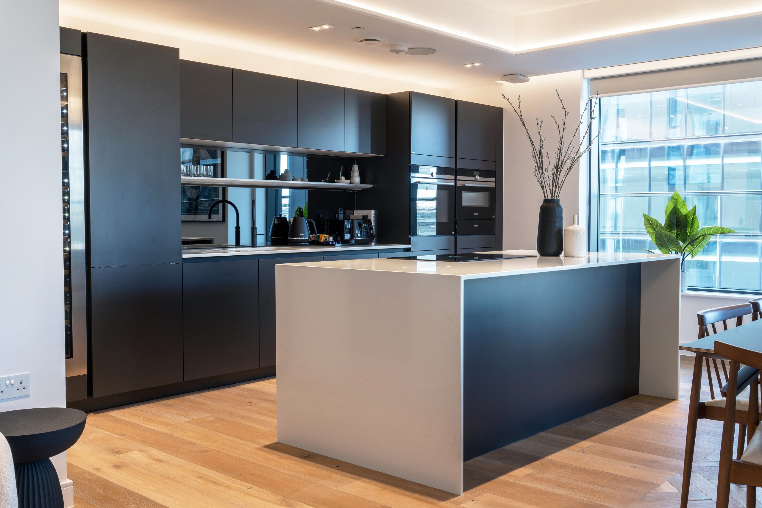 Supersuite apartment kitchen area and island