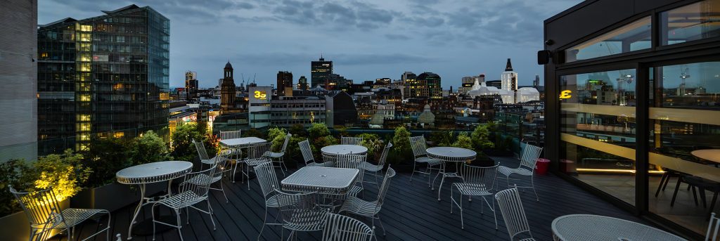 Climat restaurant outdoor seating area at night