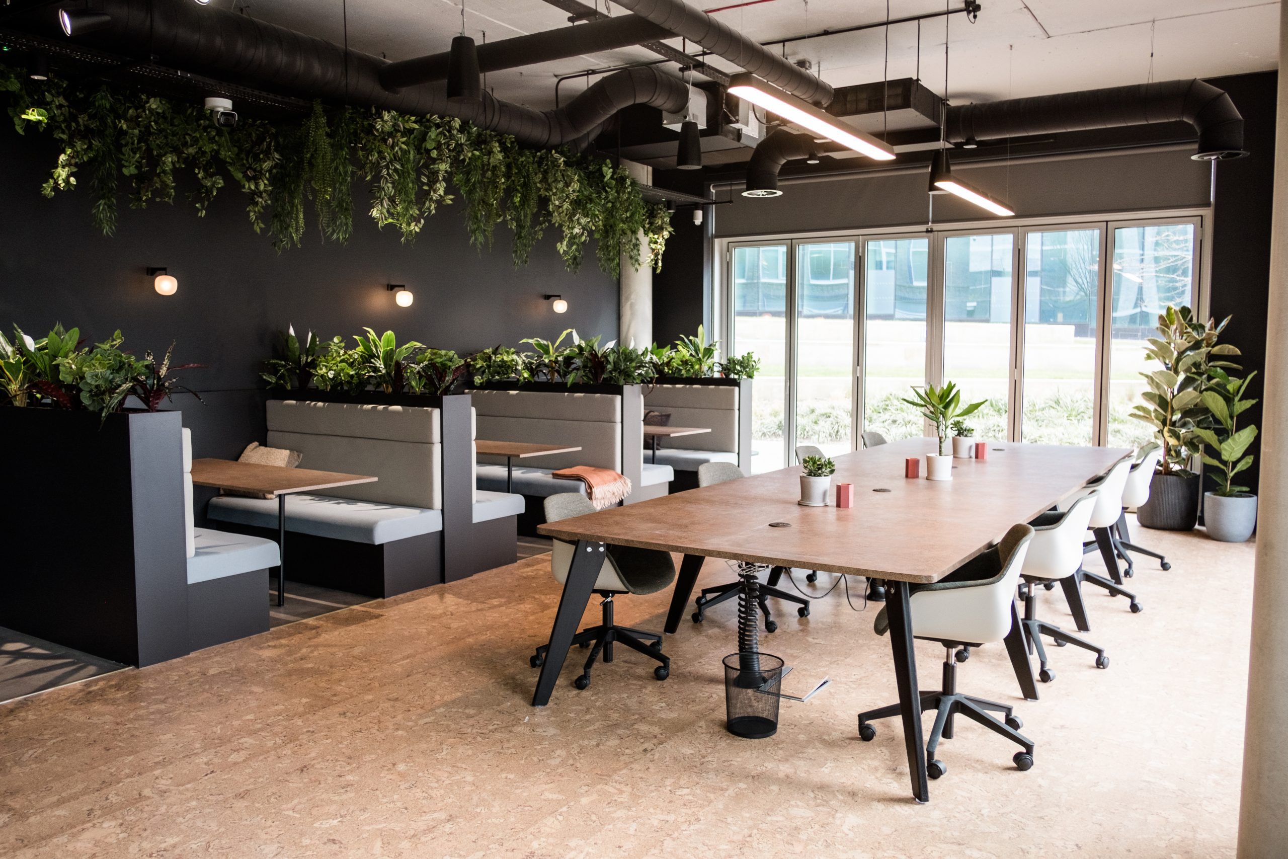 Smithfield Works booths, large table, and biophilia